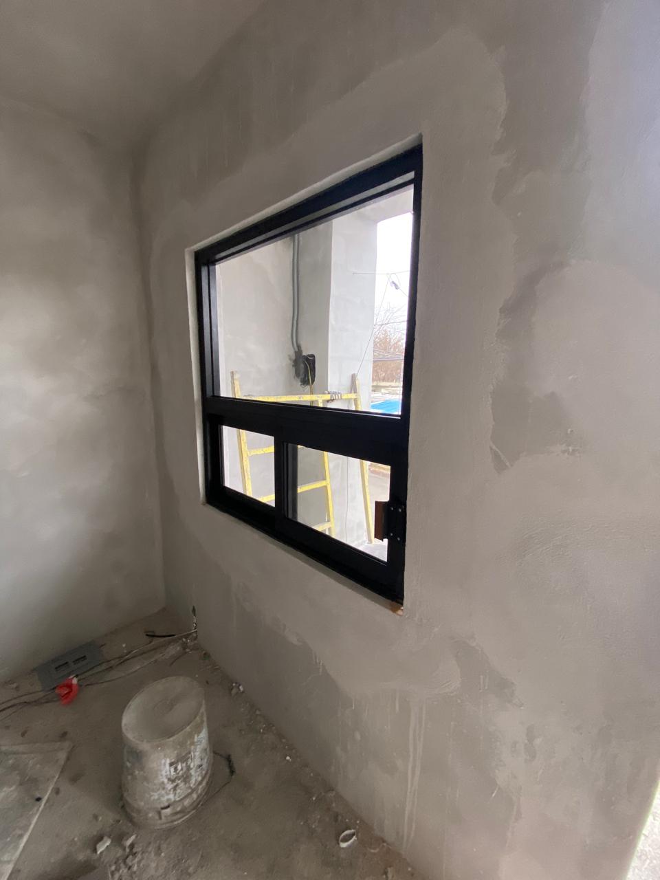 Custom cut aluminum window in a residential project by FerMac