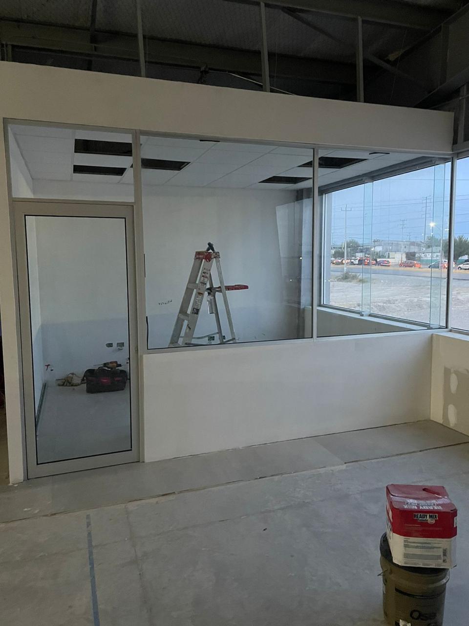 Commercial office build-out with glass partitions by FerMac — 3