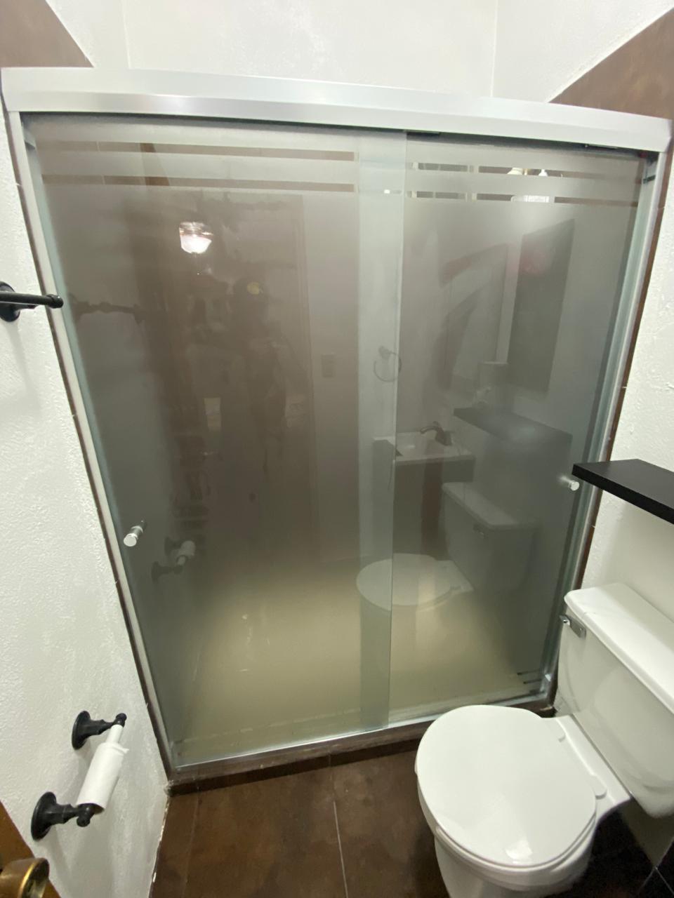 Frosted glass sliding shower enclosure with aluminum frame by FerMac