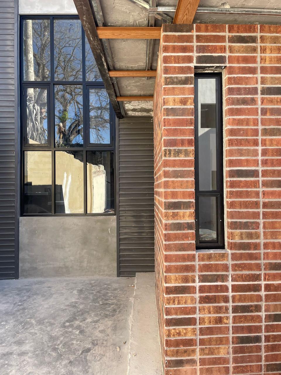 Black aluminum grid-style industrial window by FerMac