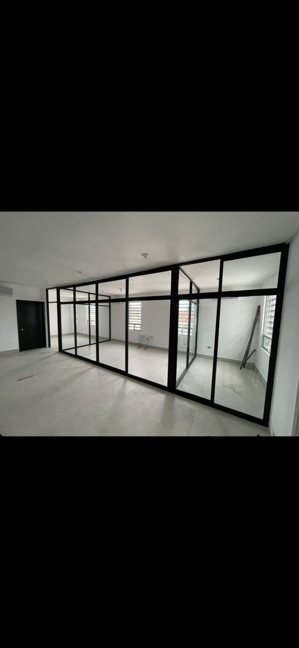 Black framed glass office partition system installed by FerMac