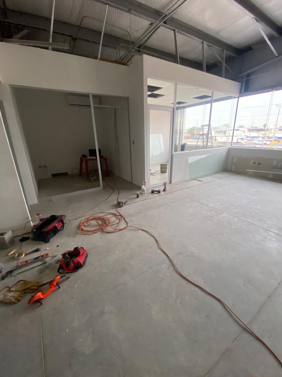 Commercial office build-out with glass partitions by FerMac