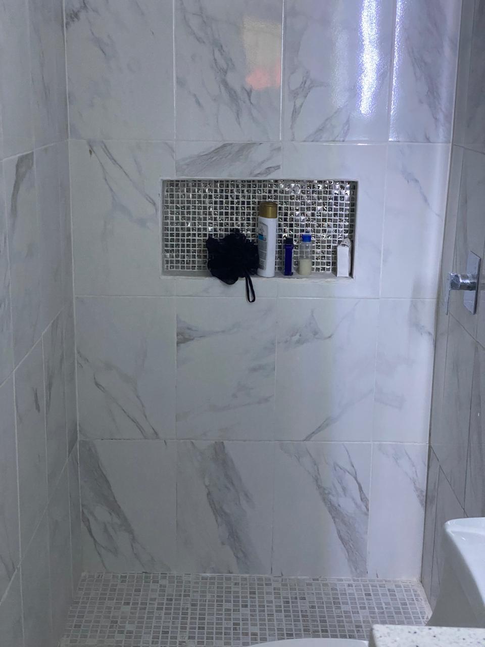 Marble bathroom shower with tempered glass enclosure by FerMac — 2