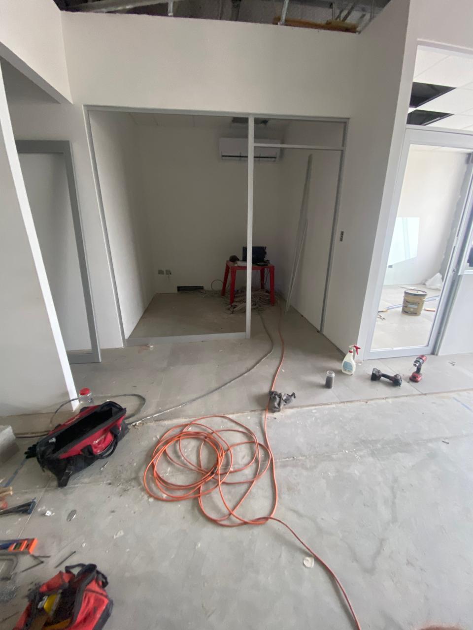 Commercial office build-out with glass partitions by FerMac — 2